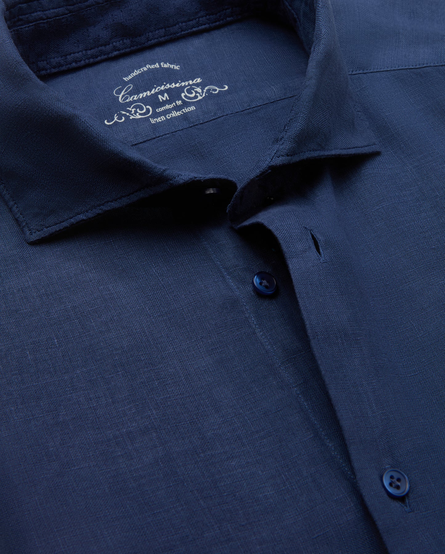 Navy blue shirt with brand logo on collar
